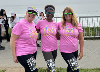 Hitting Their Stride Women runners in pink shirts at She Is Beautiful 5K Santa Cruz along West Cliff Drive
