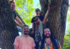 Growing Ancestree Members of Ancestree reggae band pose in a tree in Santa Cruz