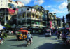 Home School Asia Busy street scene in Phnom Penh Cambodia with tuk tuks and motorbikes