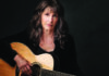 Things to do in Santa Cruz Singer-songwriter Karla Bonoff holding an acoustic guitar