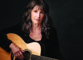 Things to do in Santa Cruz Singer-songwriter Karla Bonoff holding an acoustic guitar