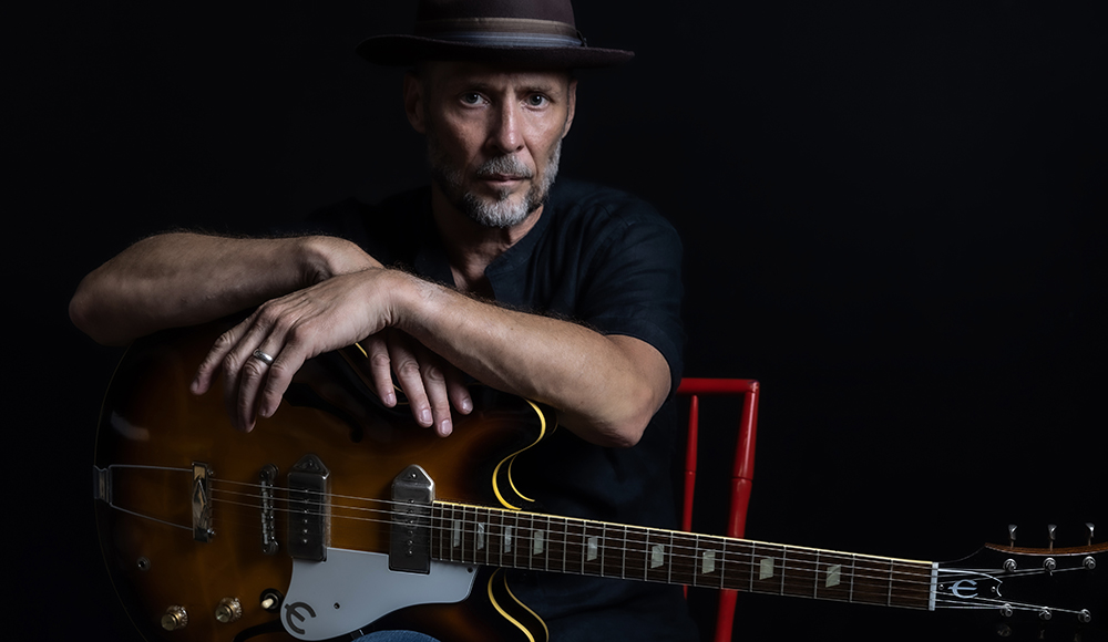 Paul Thorn singer songwriter portrait with guitar