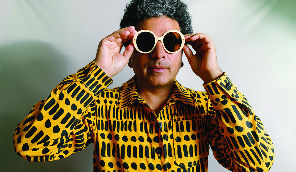 Helado Negro wearing sunglasses and patterned shirt