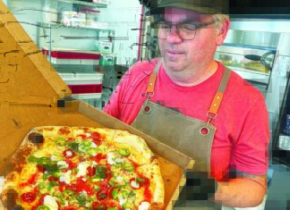 Pie of the Tiger Ryan Thompson Pogonip Pizza Santa Cruz chef holding pizza