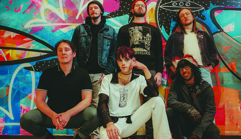 Runaway Ricochet band poses in front of colorful mural