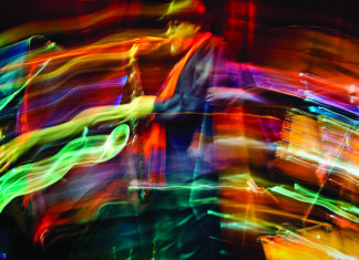 Jazz musician performing with colorful motion blur lighting