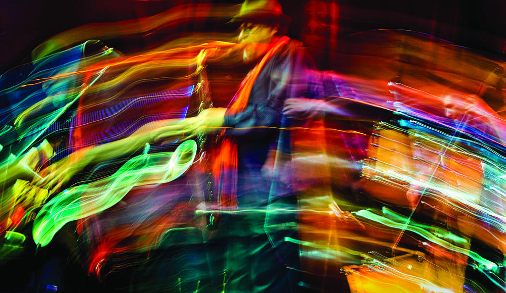 Jazz musician performing with colorful motion blur lighting