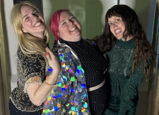 Ginger Shulick Porcella smiles with friends at the MAH Roller Ball celebration.