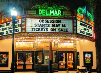 Secret Projections The Del Mar Theatre marquee lights up downtown Santa Cruz at night with a message for upcoming films.