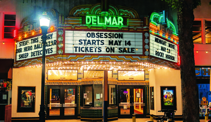 Secret Projections The Del Mar Theatre marquee lights up downtown Santa Cruz at night with a message for upcoming films.