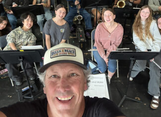 There Comes a Time Soquel High band director Jim Stewart takes a selfie with student musicians.