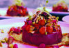 Beat It, Meat! A colorful vegan potato dish topped with beans, pistachios and sprouts.