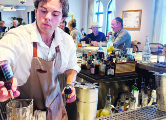 Low-Key Lux Dylan Dunphy mixes cocktail at Low Tide Bar & Grill