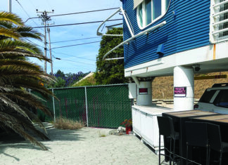 Foot Traffic Jammed A green fence blocks a beachfront walkway beside homes in Rio del Mar.