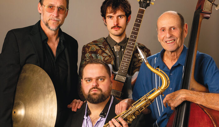 Death and Saxes Members of Santa Cruz jazz quartet Death and Saxes pose with saxophone, guitar, drums and upright bass.