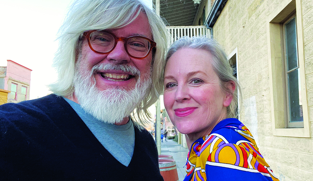 Dennis Bartok and Marja Bartok smile together outdoors in Santa Cruz.