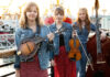 Things to do in Santa Cruz Members of bluegrass trio Sweet Sally pose with mandolin, fiddle and upright bass.