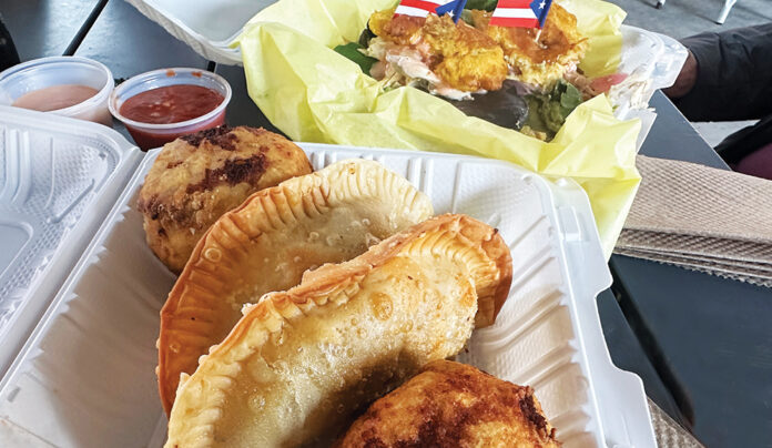 Hola Puerto Rico Puerto Rican empanadillas, fried bites and sauces from Lunaโs Borikรฉn Bites in Abbott Square.