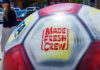 Don’t Sleep on This Close-up of a giant painted FIFA World Cup 2026 soccer ball featuring the Made Fresh Crew logo in downtown Santa Cruz.