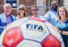 GOALLLLL Santa Cruz leaders stand behind a giant FIFA World Cup 2026 soccer ball sculpture outside the Museum of Art & History.