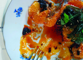 Flavor Savior A colorful citrus salad with herbs, sauce and charred accents is served on a plate at Bad Animal in Santa Cruz.