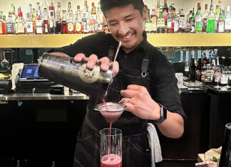 Main Place Bartender Rafael Reyes pours a pink vodka cocktail at Mane Kitchen & Cocktails in downtown Santa Cruz.