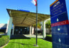 Big Relief Watsonville Community Hospital entrance sign showing directions to emergency and main entrance.