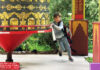 Rejoice, Rejoice A child spins a large prayer wheel at Land of Medicine Buddha in Soquel.