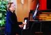Solstice Symphonies Pianist Vlada Volkova-Moran performs at a grand piano during an Espressivo concert.