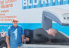 Beyond the Scale David Liotta stands in front of the BluRithm mobile DEXA scan vehicle.