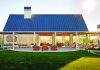 Pudding Proof Frank Family Vineyards tasting room exterior with a bright lawn and sunny patio.