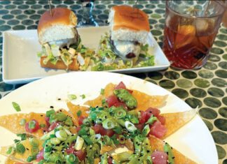 Aire Apparent Poke nachos with ahi tuna, green onions and avocado sauce are served with sliders and a cocktail at Solaire in Santa Cruz.
