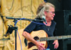 Catalyzing Effect Alabama Annie performs with an acoustic guitar at the Catalyst Atrium in Santa Cruz