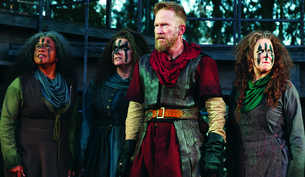 Dan Donohue as Macbeth stands with witches Patty Gallagher, Carolyn Ratteray and Renée Torchio MacDonald