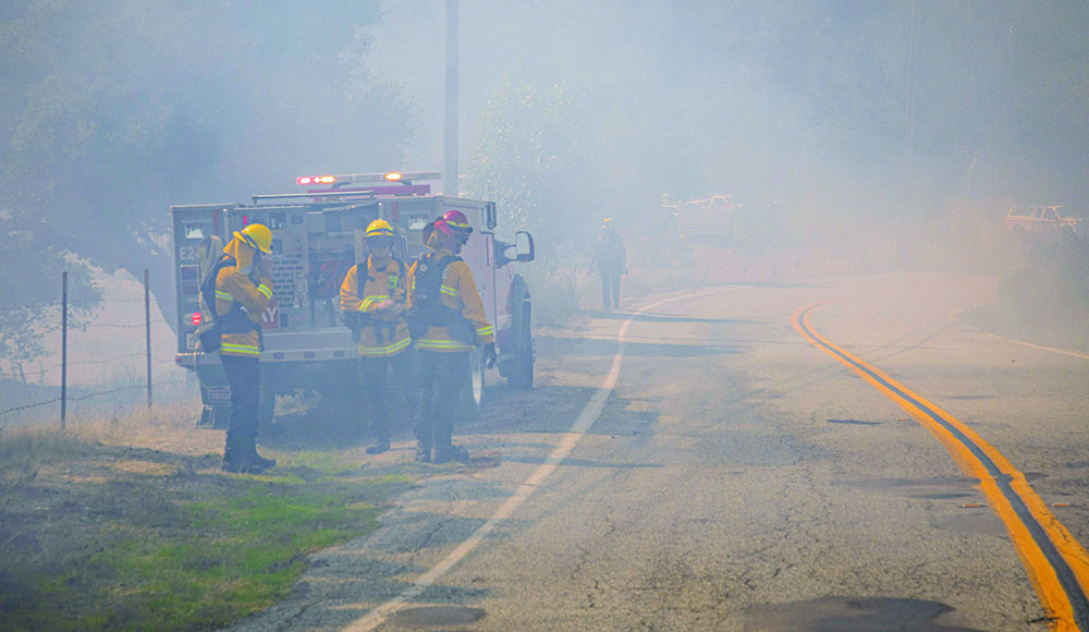 Zayante firefighters respond to a smoky roadside wildfire