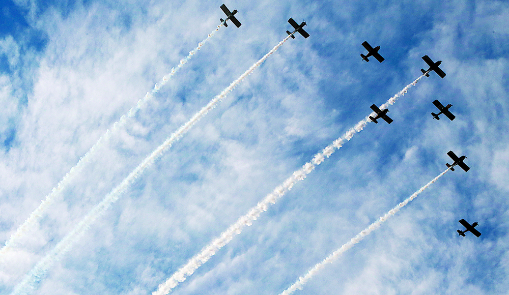 Planes leave smoke trails over Watsonville during Fourth of July parade festivities