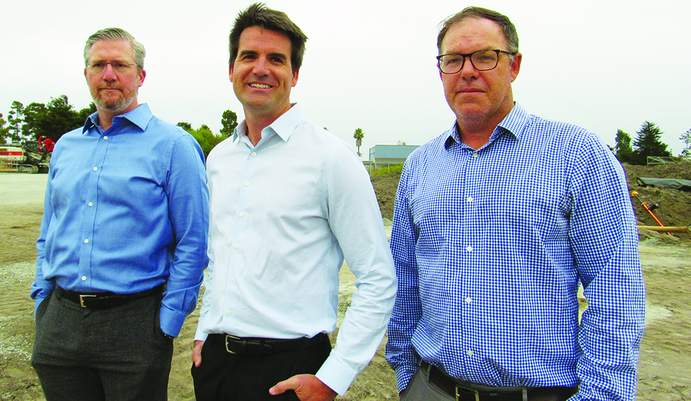 Bogard Construction leaders Jared Bogaard, Ryan Bogaard and Dave Sullivan stand at the future Santa Cruz City Schools staff housing site