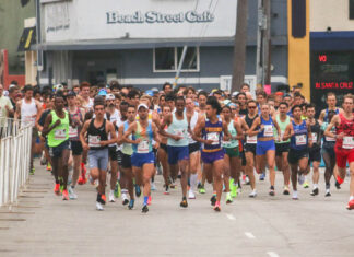 The Race is On Runners cross the starting line during a past Wharf to Wharf race in Santa Cruz