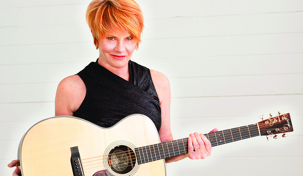 Singer-songwriter Shawn Colvin holding an acoustic guitar