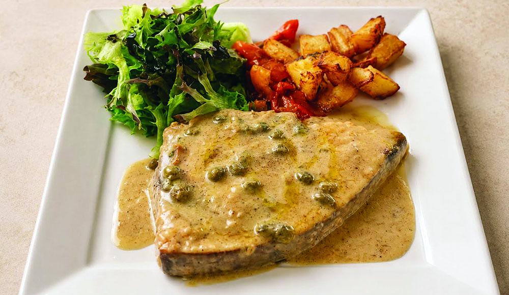 Swordfish picatta with capers, roasted potatoes and mixed greens at La Placa Italian Cuisine.