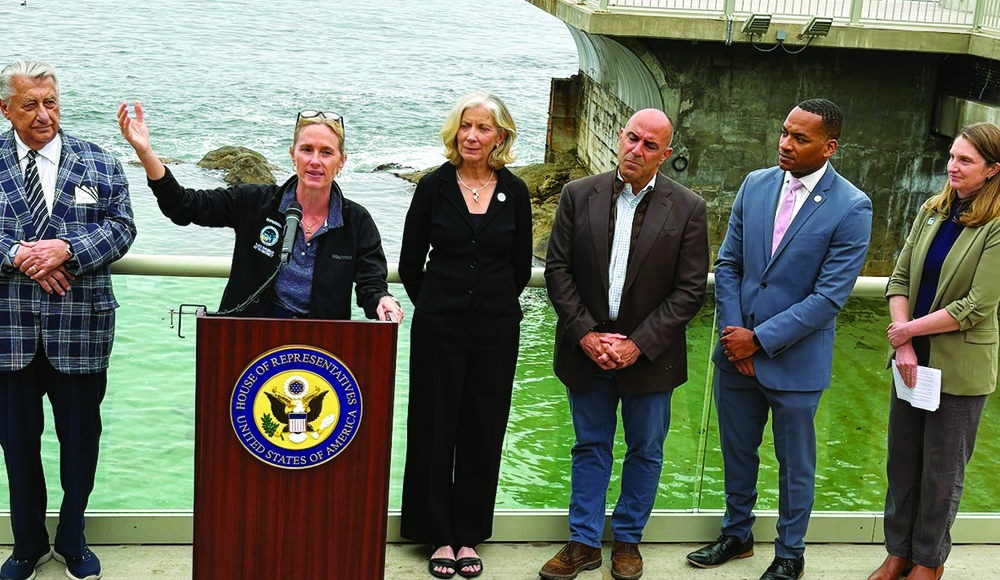 Rep. Jimmy Panetta and Central Coast officials gather at a Monterey Bay Aquarium news conference opposing offshore drilling.