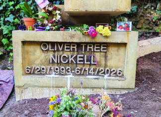 Seedlings of Inspiration Oliver Tree Nickell’s flower-covered grave at Evergreen Cemetery