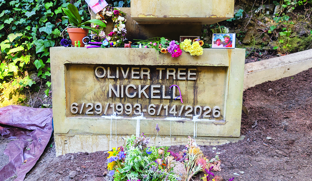 Oliver Tree Nickell’s flower-covered grave at Evergreen Cemetery