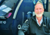 Under Pressure Dr. Jay Pennock sits beside a hyperbaric oxygen therapy chamber at Rejuvenate Medi-Spa and Wellness Center.