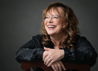Volcanic Variations: Adela Najarro Santa Cruz poet Adela Najarro smiling for a studio portrait.