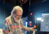Guitar Greats Gather Saturday Santa Cruz Guitar Company founder Richard Hoover examines a handcrafted acoustic guitar.