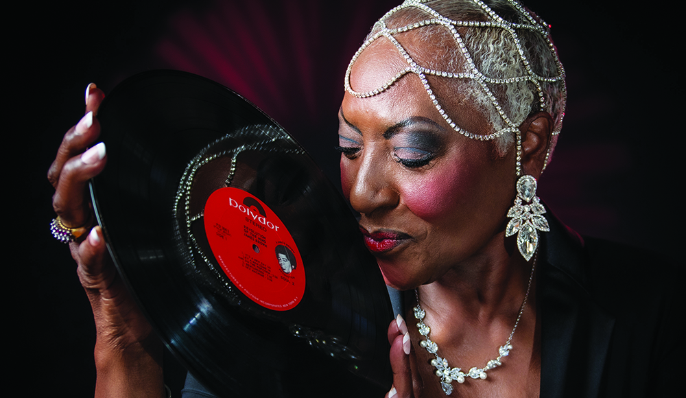 Funk singer Martha High holds a vinyl record ahead of her Kuumbwa Jazz Center performance in Santa Cruz.