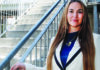 The Power of Yes Janus CEO Amber Williams stands beside an outdoor staircase in Santa Cruz County.