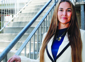The Power of Yes Janus CEO Amber Williams stands beside an outdoor staircase in Santa Cruz County.