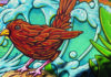 The Rise of Slogan Detail of Shaun Logan’s colorful bird-and-wave mural at Hidden Beach in Aptos